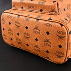 MCM Stark Visetos Medium Backpack – Cognac Monogram with Gold-Tone Studs